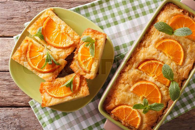 Sliced Greek Orange Pie With Phyllo - Portokalopita close-up on a table. Horizontal view from above , stock photo