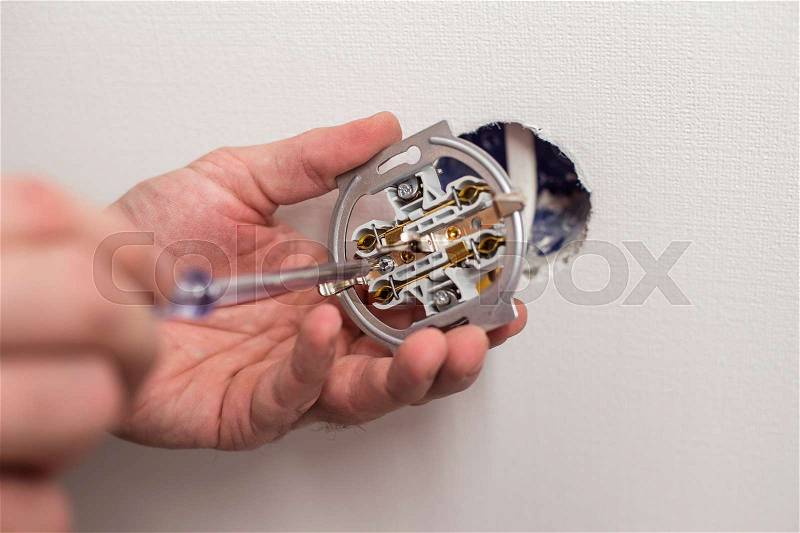 Installation of electrical outlets in the apartment, stock photo