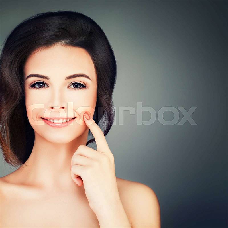 Spa Beauty. Cute Young Woman with Healthy Skin. Skincare, Spa Beauty and Cosmetology Concept on Blue Background with Copy space, stock photo