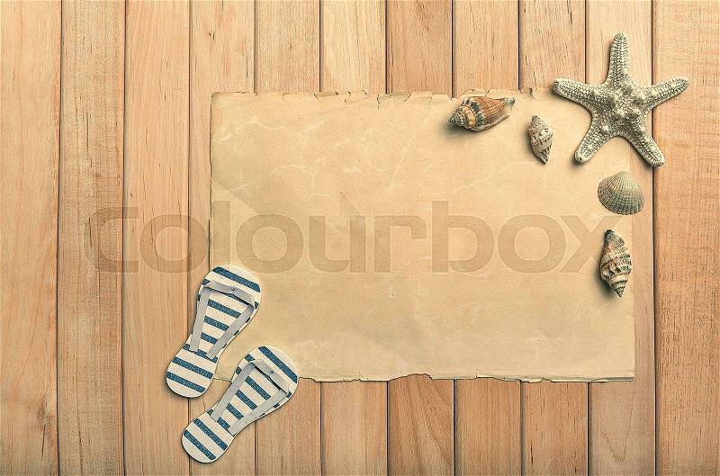 Old paper flip-flops and starfish. Summer still life, stock photo