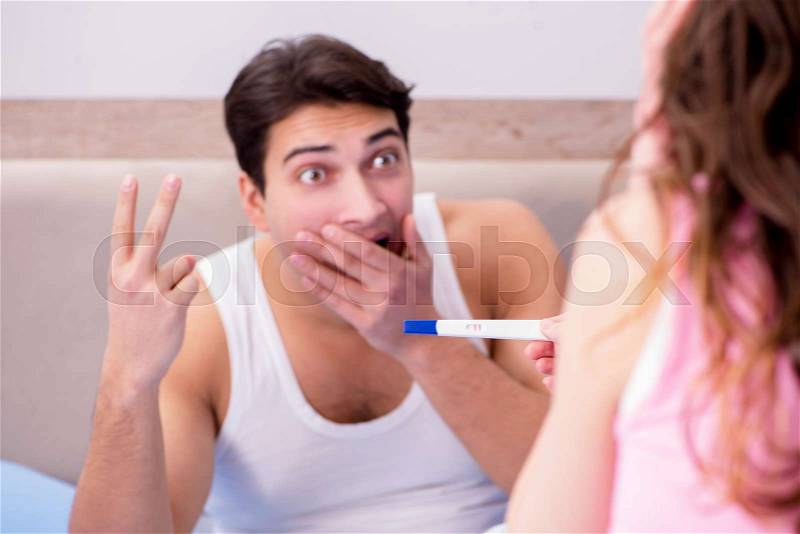 Man husband upset about pregnancy test results, stock photo