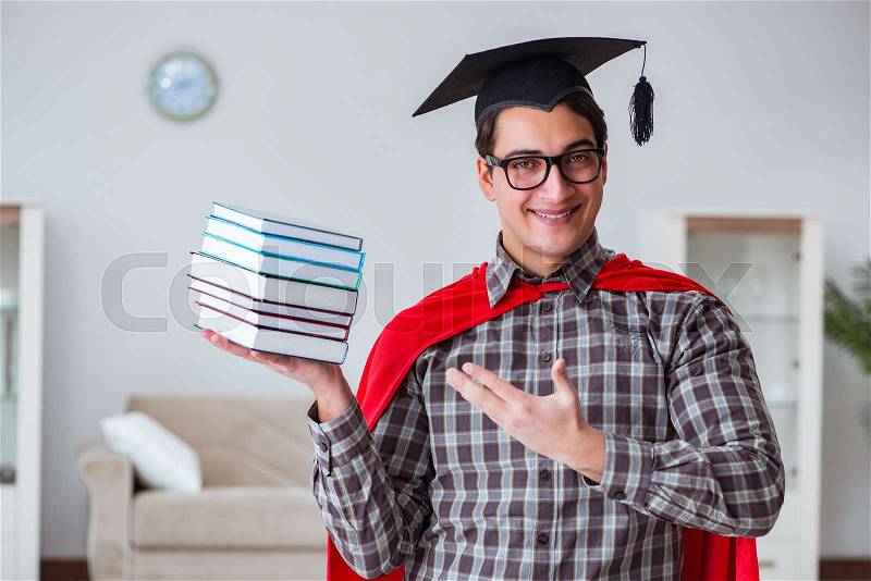 Super hero student with books studying for exams, stock photo