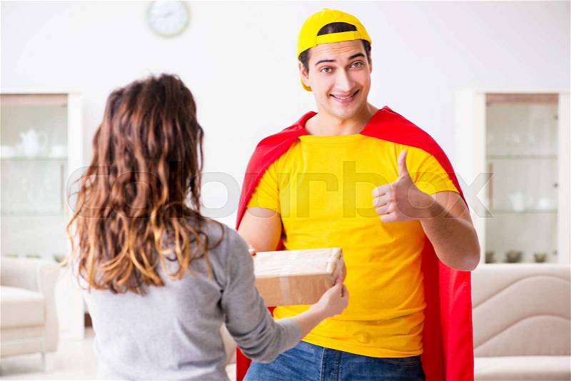 Superhero delivery guy with box, stock photo