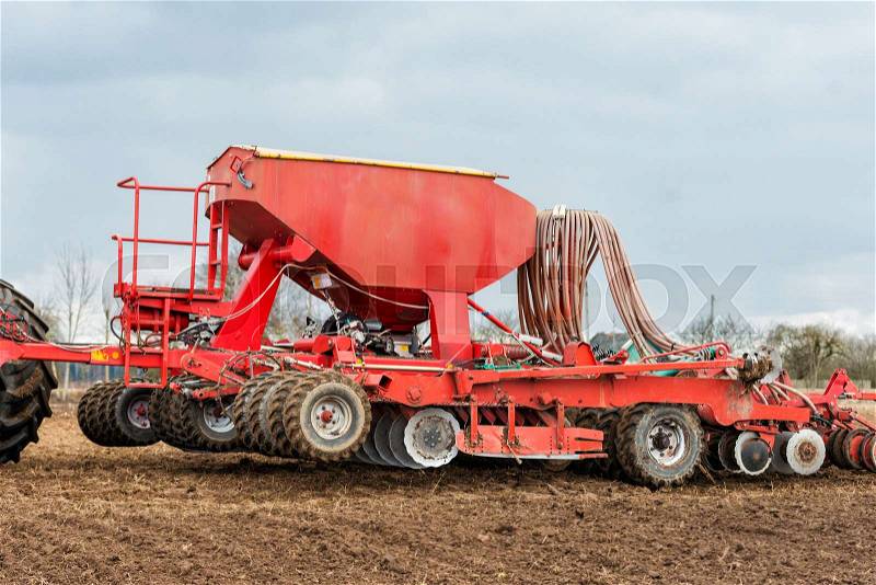 Farmer tractor working in the field. Spring time for sowing. Planting crops. , stock photo