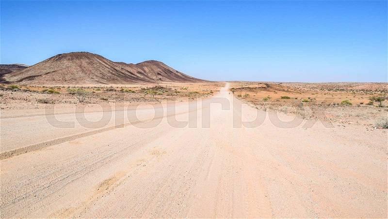 Abandoned area with dusty dirt road in Namibia, Africa, stock photo