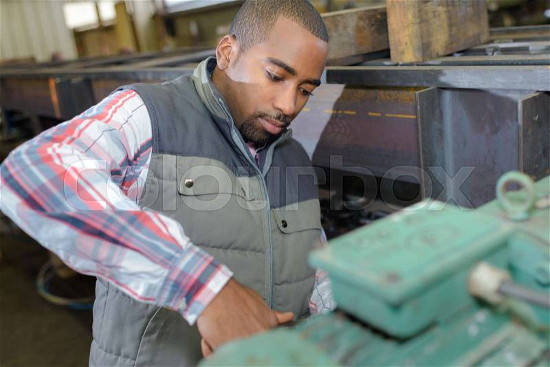 Factory worker on the job, stock photo