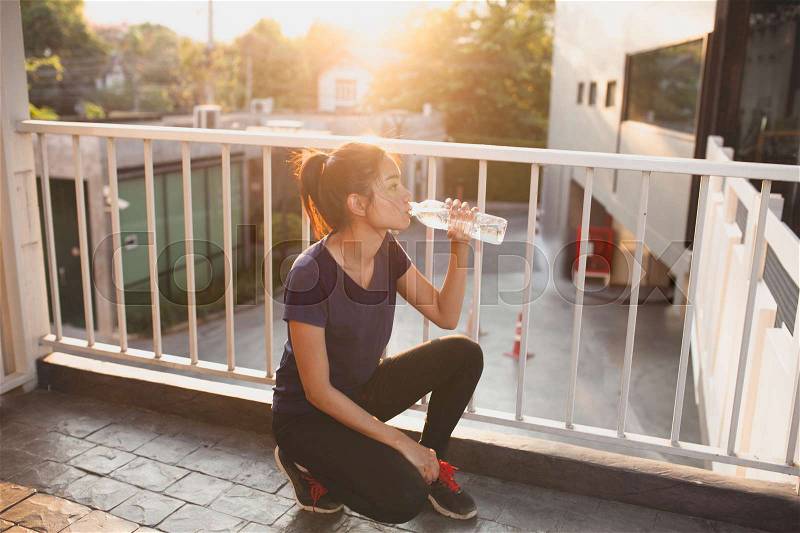 Sports women relax time and drinking water, stock photo