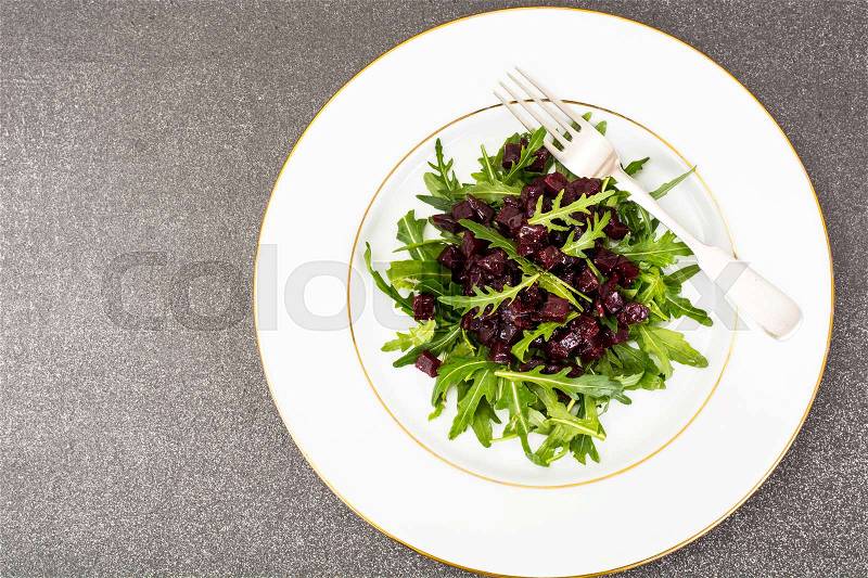 Healthy food-dishes from beets and arugula. Studio Photo, stock photo