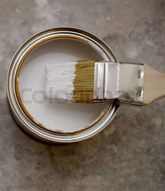 Brush and bank of white paint, stock photo