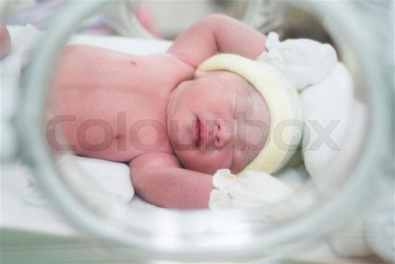 New born baby in hospital after delivery, mom and baby concept, stock photo
