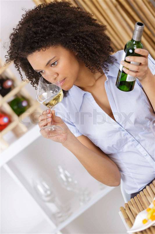 Beautiful young lady alone in restaurant, stock photo