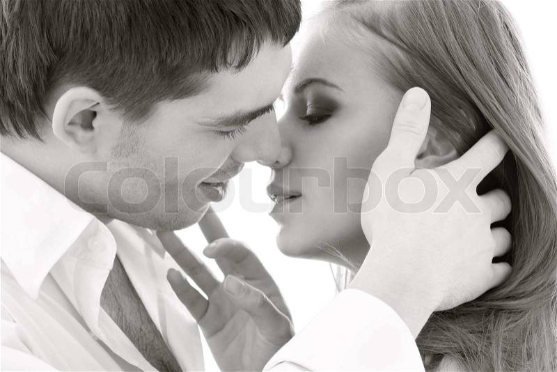 Monochrome picture of couple in love over white, stock photo