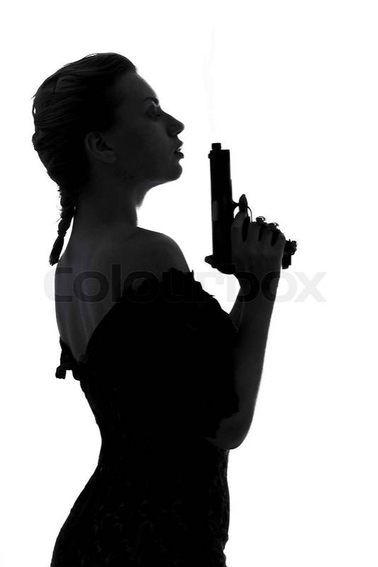 Silhouette image of pretty girl with smoking gun, stock photo