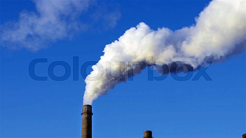 Factory plant smoke stack over blue sky background. Energy generation and air environment pollution industrial scene, stock photo