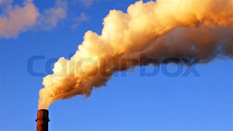 Factory plant smoke stack over blue sky background. Energy generation and air environment pollution industrial scene, stock photo