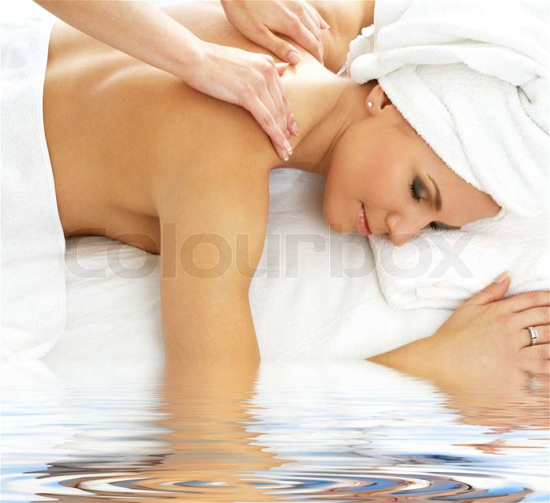 Picture of lovely lady relaxing in massage salon, stock photo