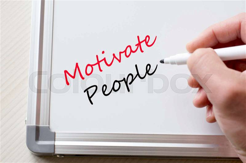 Human hand writing motivate people on whiteboard, stock photo