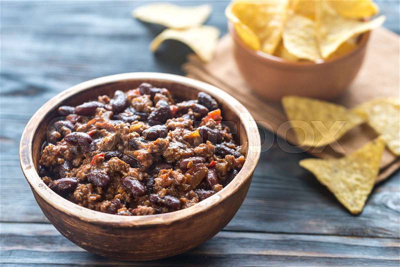 Bowl of chili con carne with tortilla chips, stock photo