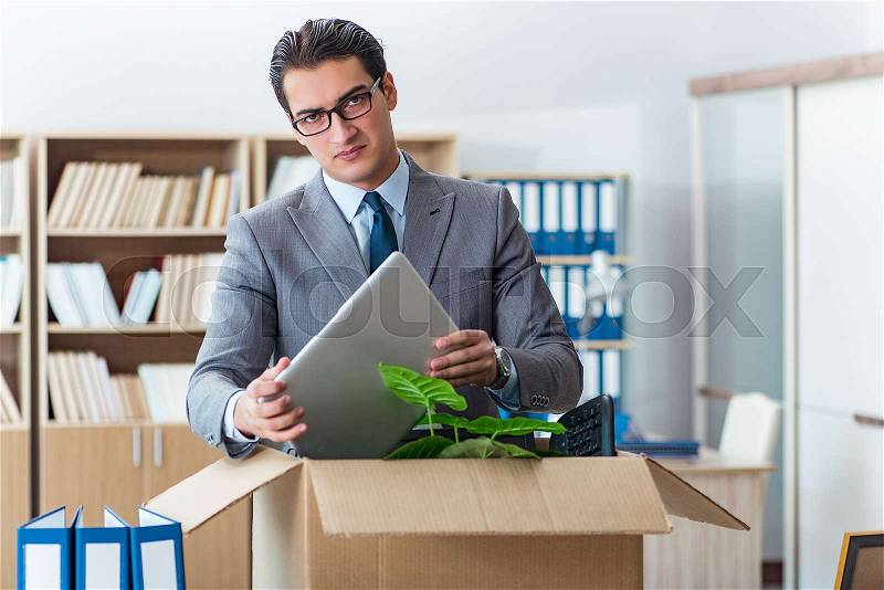 Man moving office with box and his belongings, stock photo