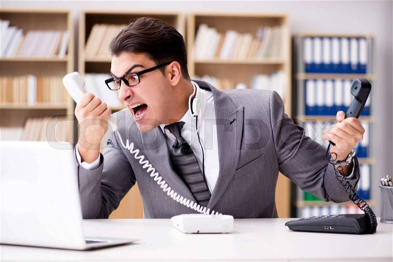 Angry helpdesk operator yelling in office, stock photo