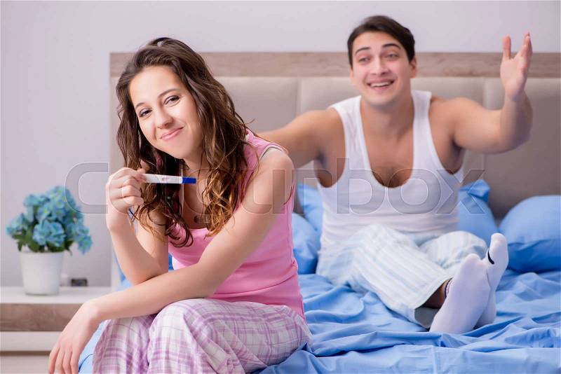 Happy couple finding out about pregnancy test results, stock photo