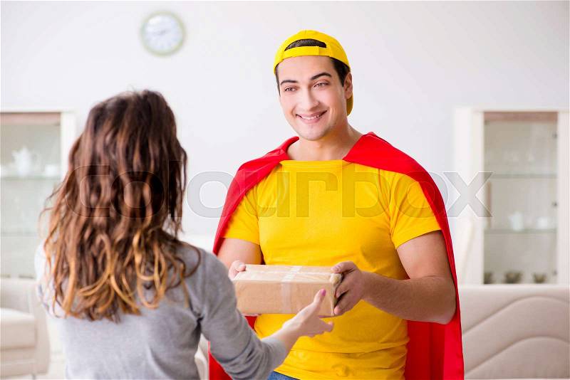 Superhero delivery guy with box, stock photo