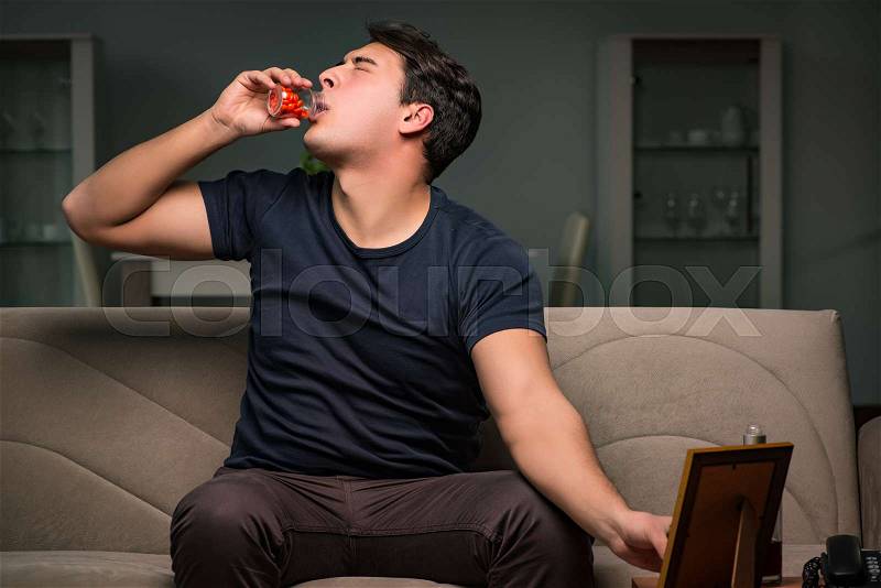 Desperate man thinking of suicide, stock photo