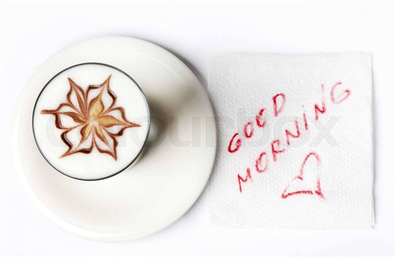 Barista latte coffee glass with good morning note on tissue, stock photo