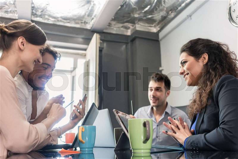 Team of creatives having meeting in agency office , stock photo