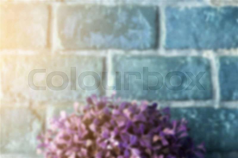 Blurred of brick wall and purple leaf with morning sunlight, Vintage style, stock photo