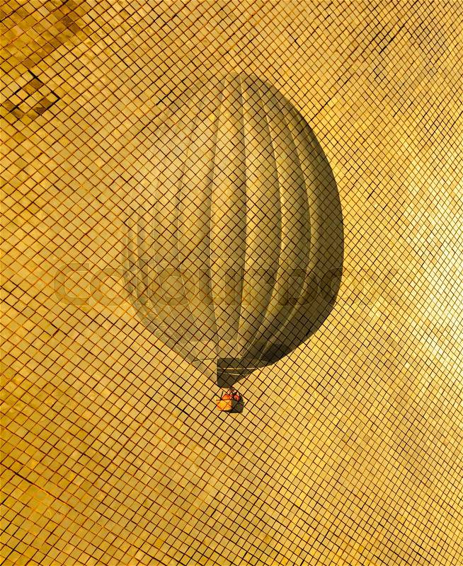 Retro style air balloon on golden pattern. Vintage toning travel background. Modern illustration picture for decoration apartments, stock photo