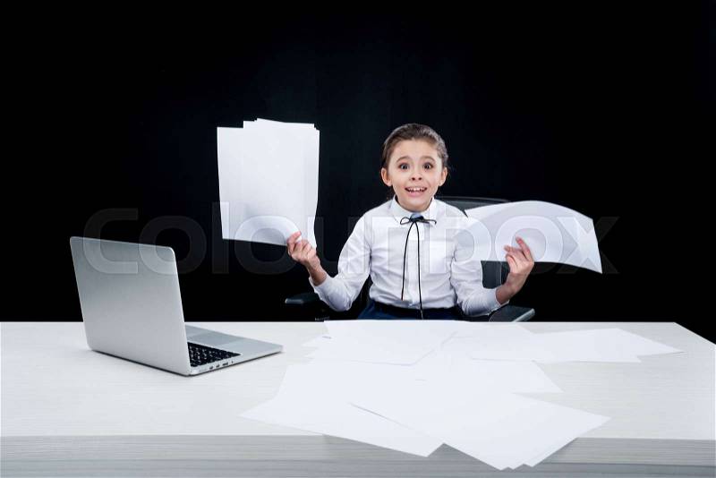 Girl working with documents at workplace on black, stock photo