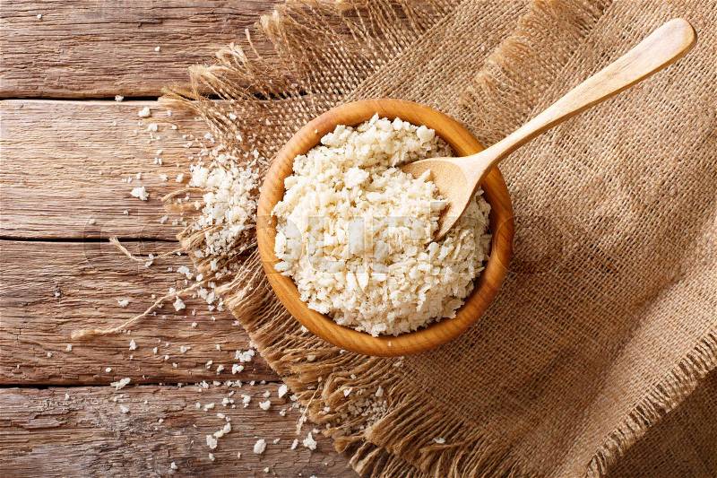 Japanese bread crumbs Panko in a bowl on the table. horizontal view from above , stock photo