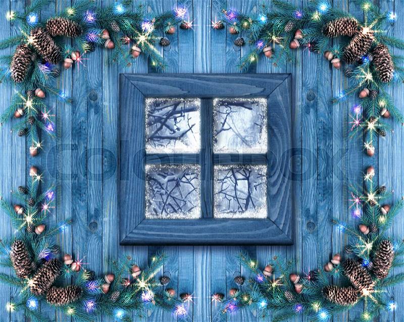 Christmas wooden windows decorated with New Year decor in rustic vintage style with light illumination, snow and spruce. Winter holidays concept, stock photo