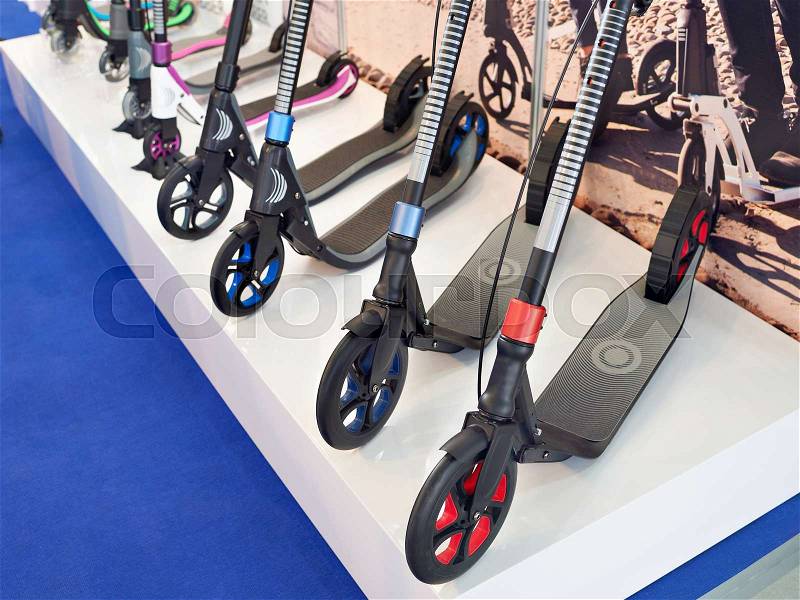 Push Scooters in sport shop closeup, stock photo