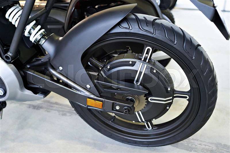 Rear wheel electric motorcycle with an engine inside, stock photo