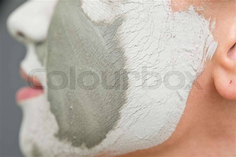 Close up of clay mask on woman face, stock photo