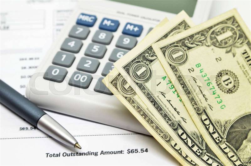 Financial composition on the table with money, calculator and pen, stock photo