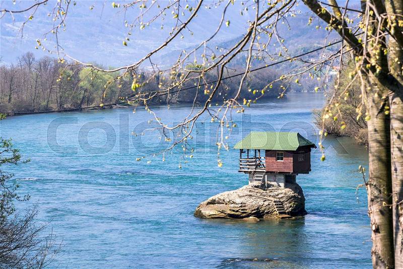 House on the stone in middle of river,selective focus , stock photo