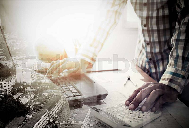 Double exposure of success land developer working in office with laptop and calculator, stock photo