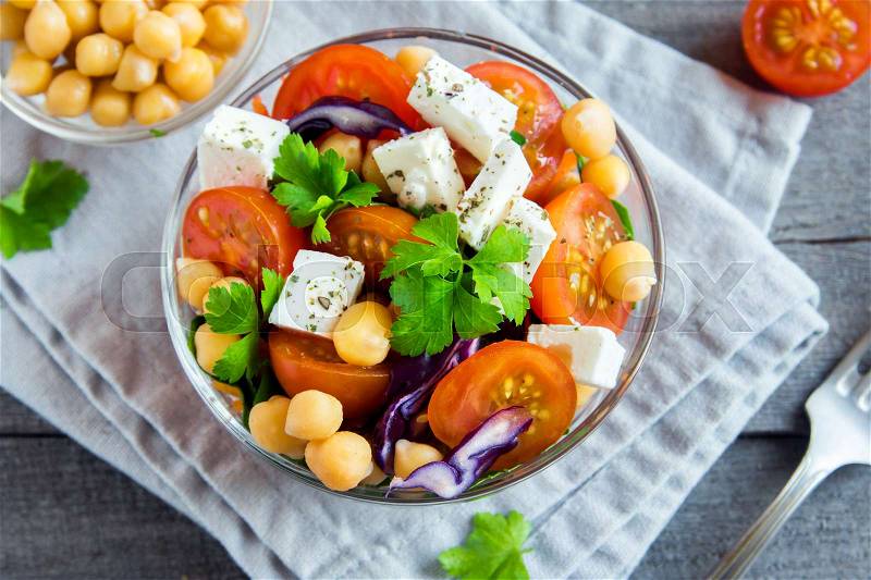 Chickpea and veggie salad with tomatoes, red cabbage, feta cheese (tofu) - healthy homemade vegan vegetarian diet detox salad meal food, stock photo