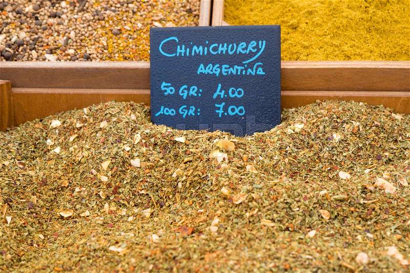 Close up detail of chimichurry, traditional Argentina spice, for sale on a market stall, stock photo