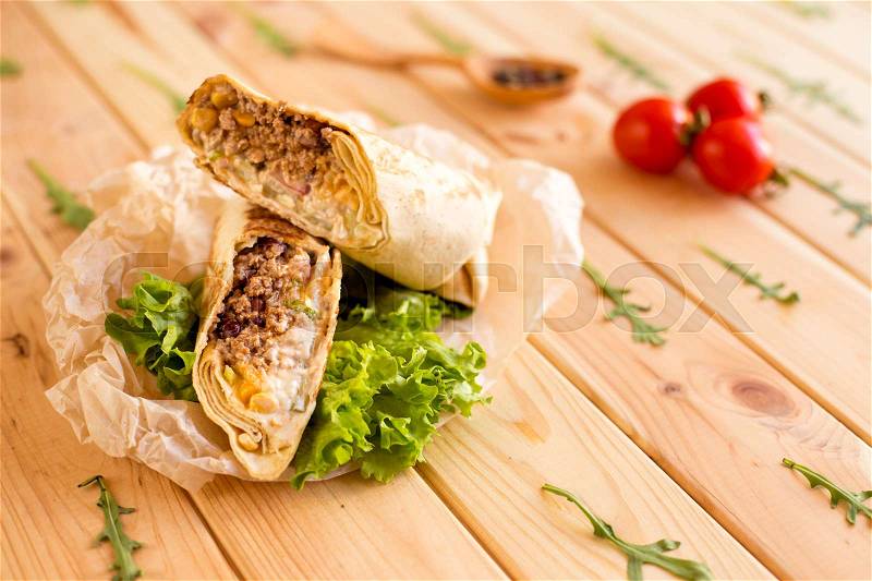 Mexican restaurant fast food, wrapped burritos with pork, stock photo