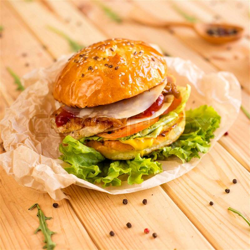 Classic cheeseburger with chicken meat and caramelized onions, stock photo