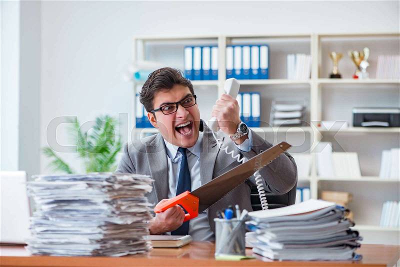 Angry aggressive businessman in the office, stock photo