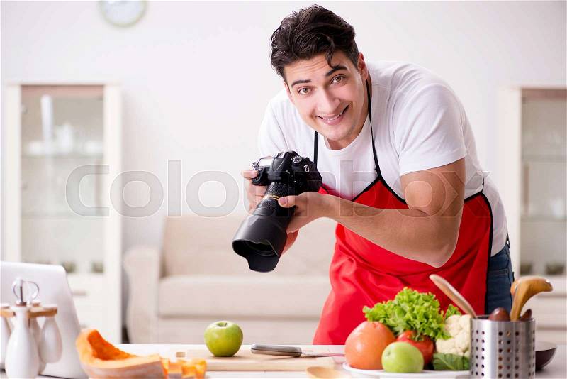 Food blogger working in the kitchen, stock photo