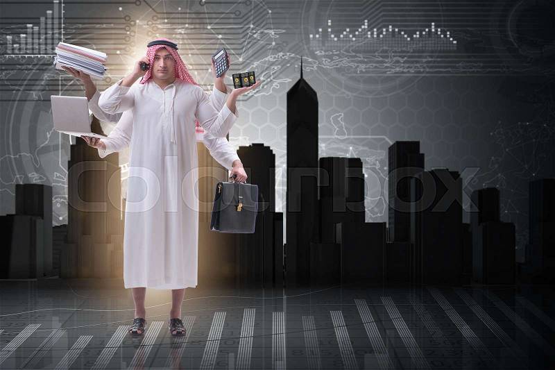 Arab businessman in multitasking concept, stock photo