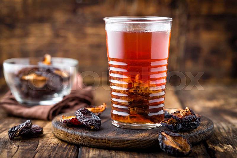 Prune drink, dried plums extract, fruits beverage, stock photo