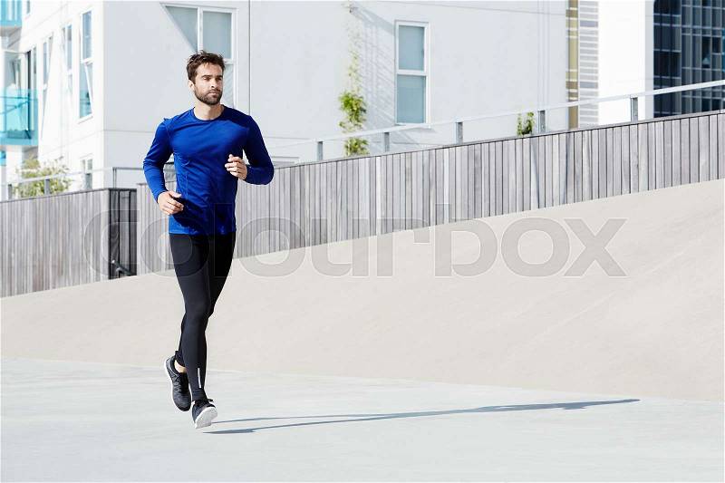 Jogging man in sportswear, stock photo