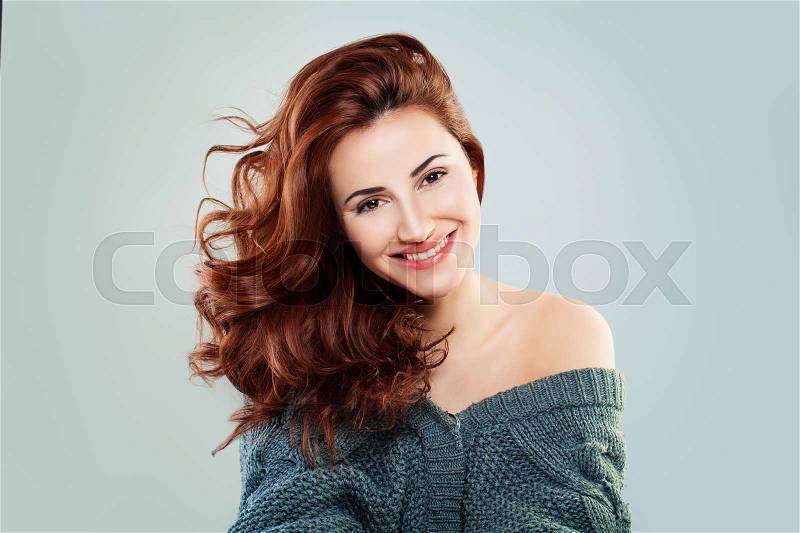 Redhead Woman Fashion Model Smiling. Pretty Girl on Grey Background, stock photo